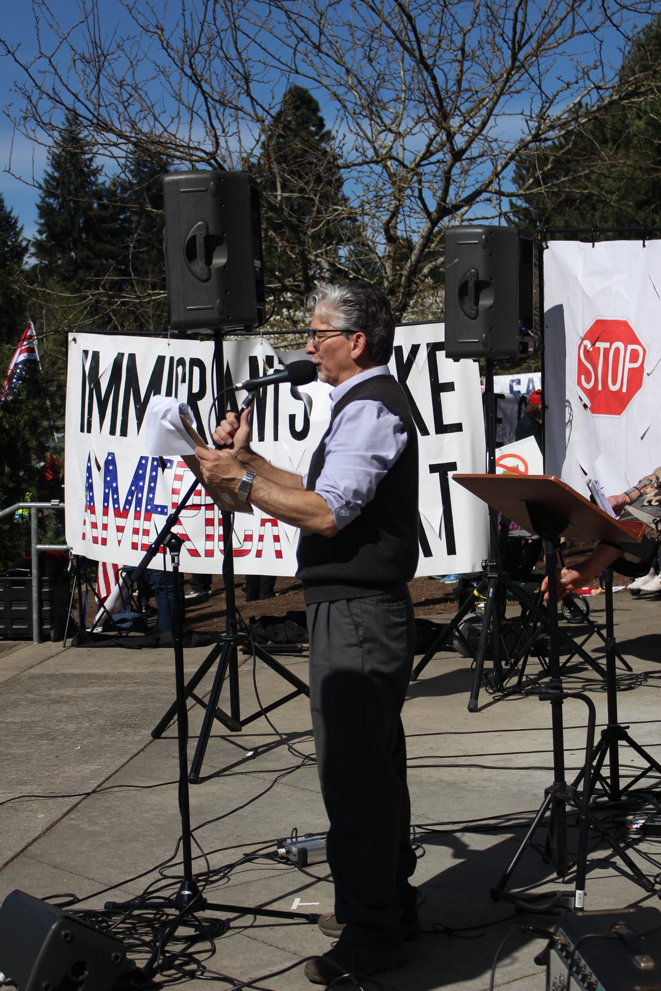 One of the event organizers, his speech was interrupted after he pointed out I.C.E. agents on the edge of the protest and groups of people started blowing whistles to the general public of their position (Will Legg / VanCougar)