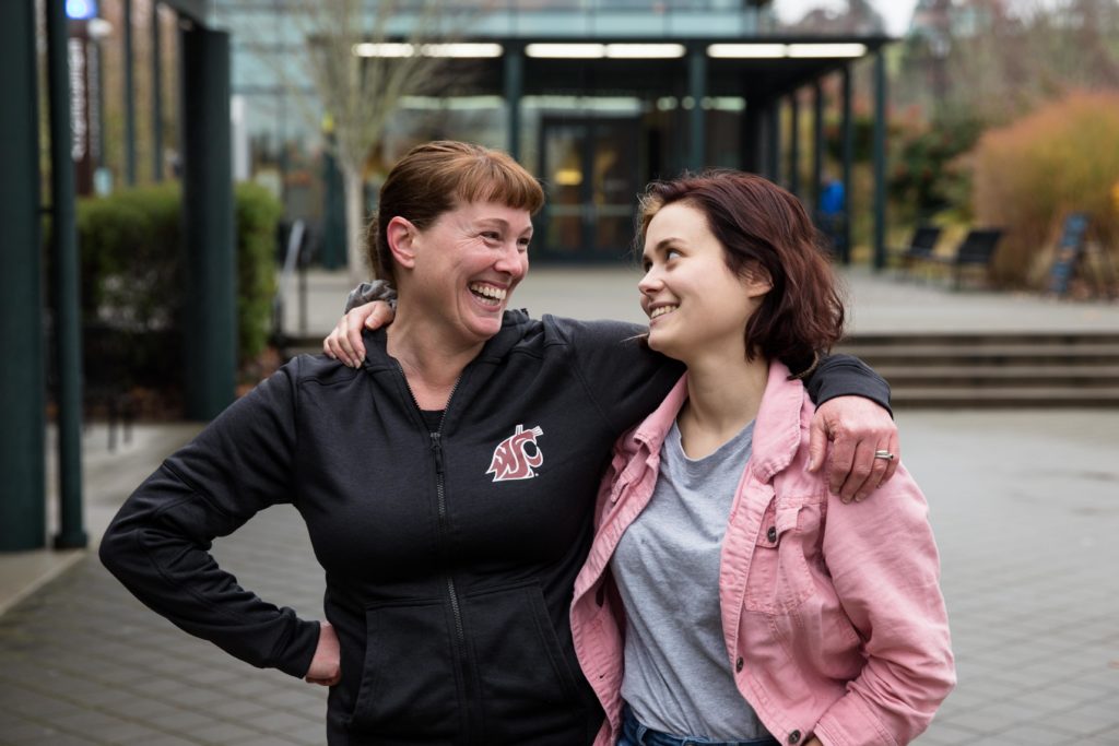 Mom and Daughter smiling at each other