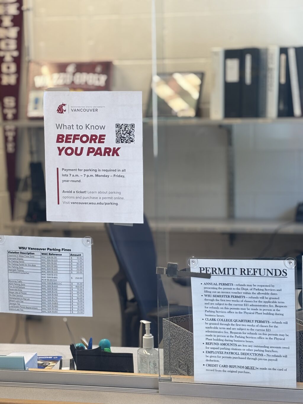 Memos about parking services and permits in the WSUV Department of Public Safety and Parking Services office. (Elizabeth Flores/The VanCougar)