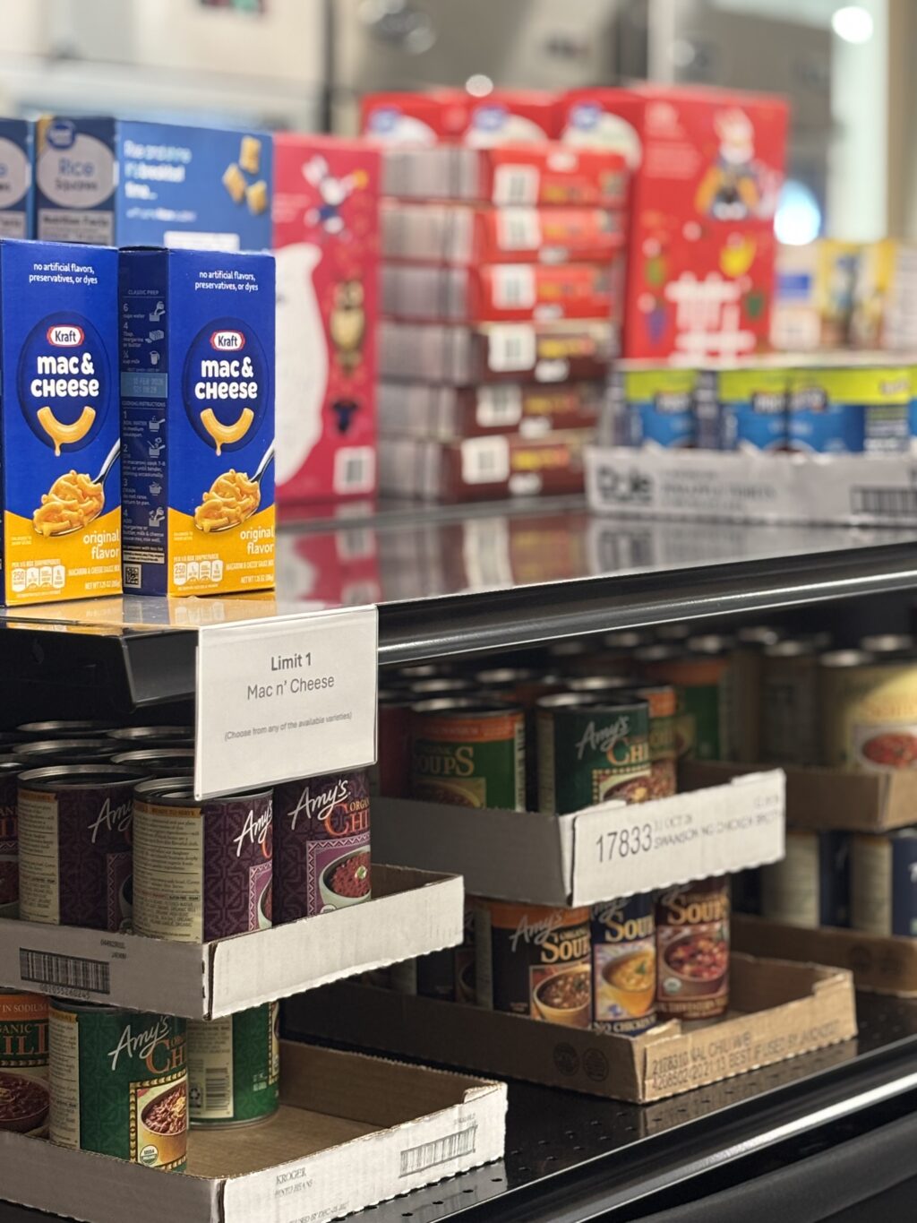 An assortment of non-perishable and canned food sits on a shelf at the Cougar Food Pantry. (Elizabeth Flores/The VanCougar)