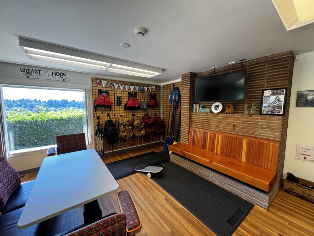 A seating area and supplies for hiking and water activities at the WSU Vancouver Rec Office. (D Turk/The VanCougar)