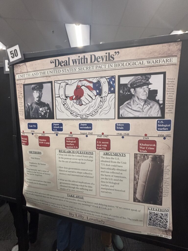 A photograph showing the presentation board for the project "Deal with Devils: Unit 731 and the United States Secret Pact in Biological Warfare." Photograph taken by Max Murphy.
