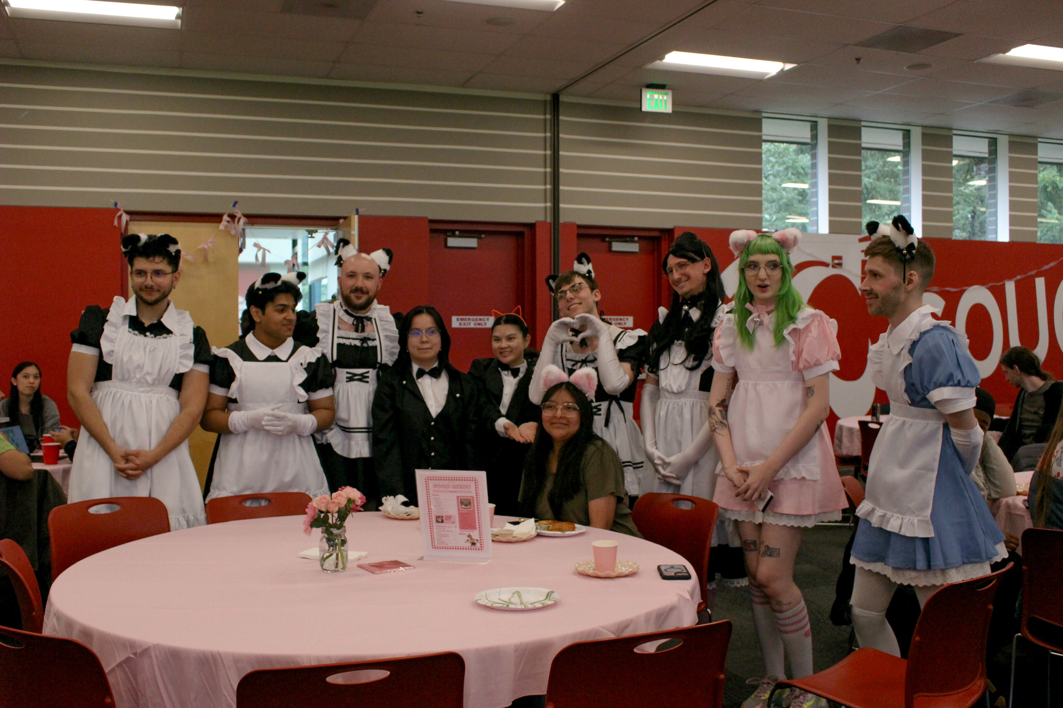 Photo shows all of the student maids circling around student Stephane as they sing happy birthday to her. Photo taken by Will Legg.