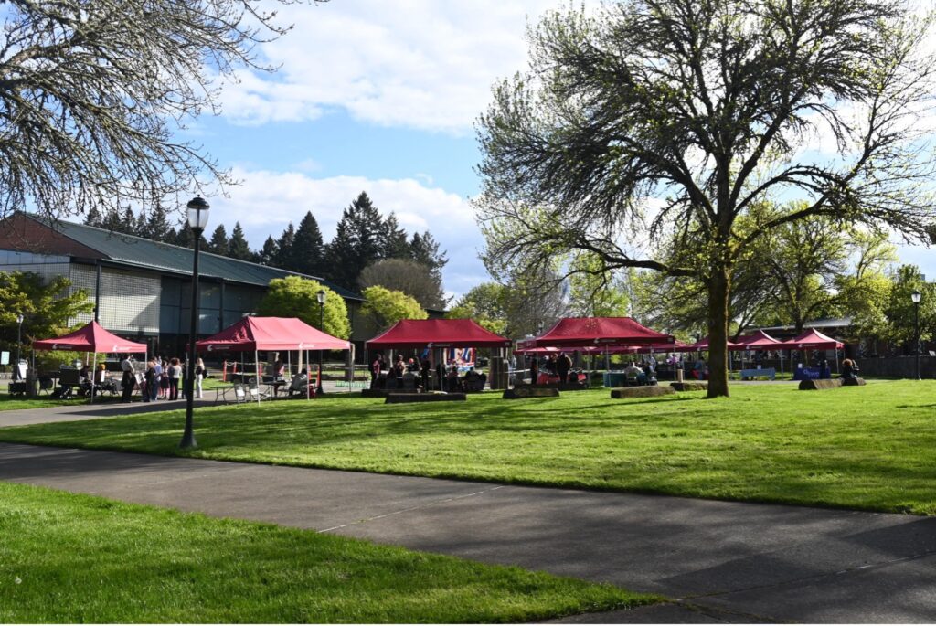 Photo taken at the beginning of the RSO Spring Festival, featuring tents amongst the grass by the quad at WSUV campus. Photo taken by Noemi Jimenez.