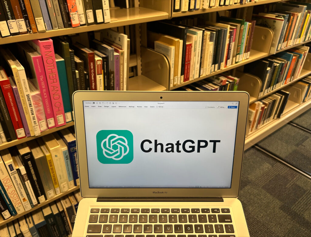 A photo showing a computer with the ChatGPT logo on the screen. Photo taken by Brianna Reil.