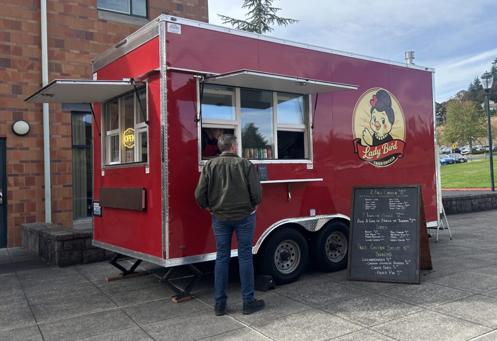 Student ordering from the new Lady Bird Fried Chicken Food Truck (Brianna Reil / VanCougar)
